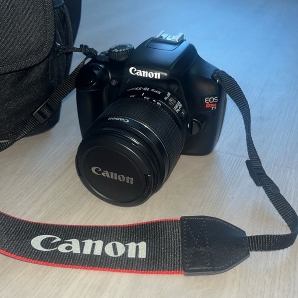 Canon EOS Rebel T3 camera with charger and bag